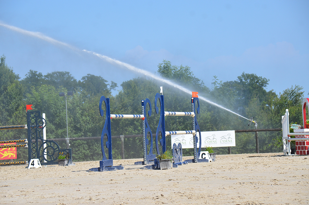 Watering equestrian training areas
